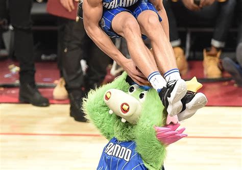 Aaron Gordon showcases his leaping ability with a dunk over the mascot